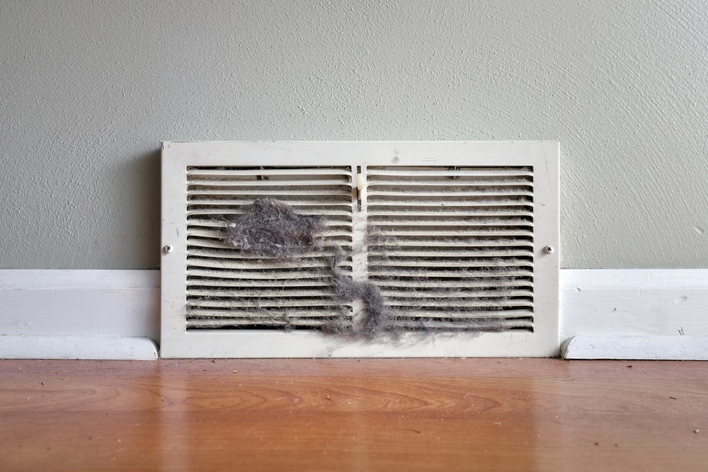 Dirty,Register,Wall,Vent,With,Dust,Clogging,The,Duct,Opening